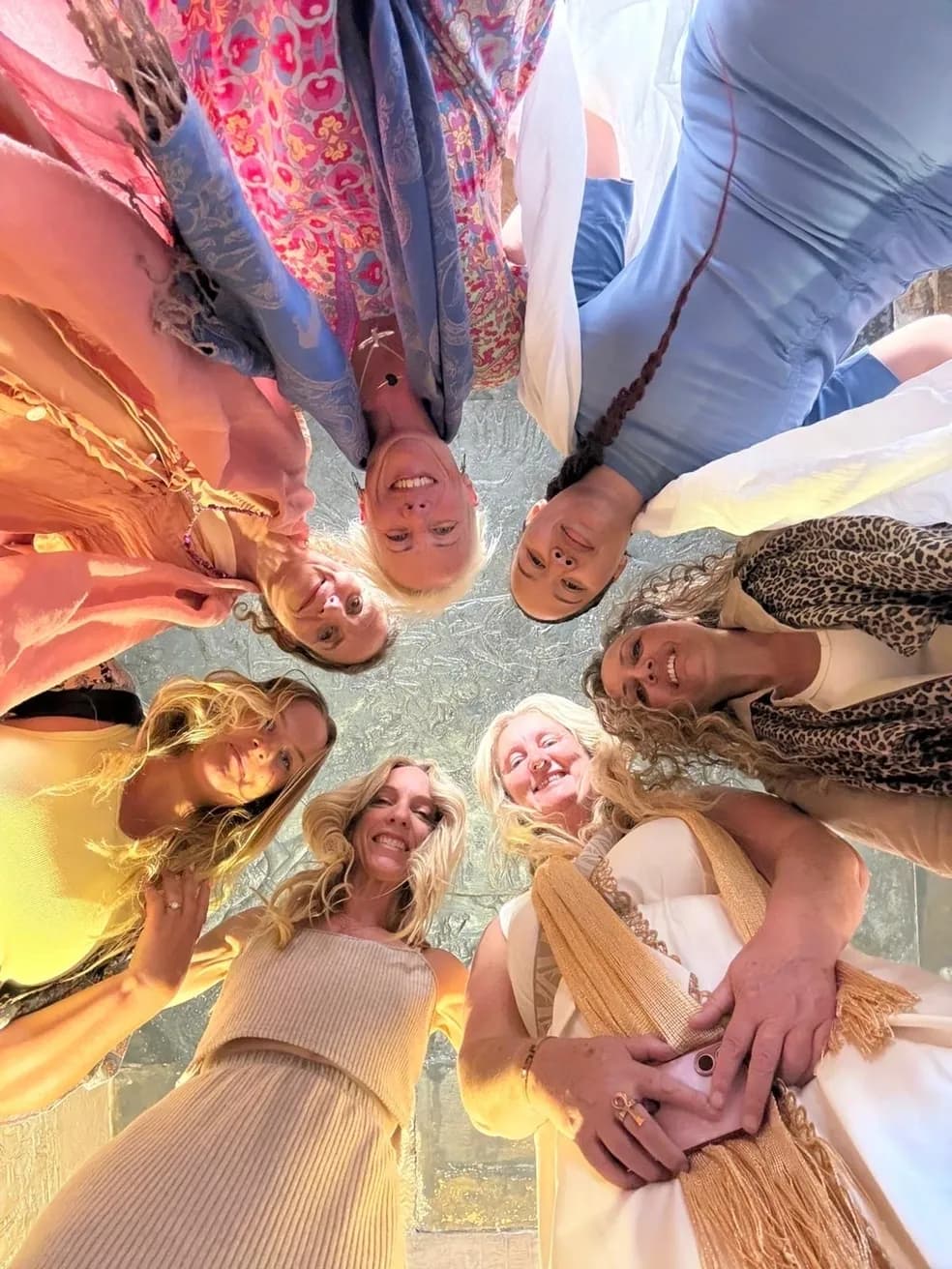 Travellers joining hands in a circle