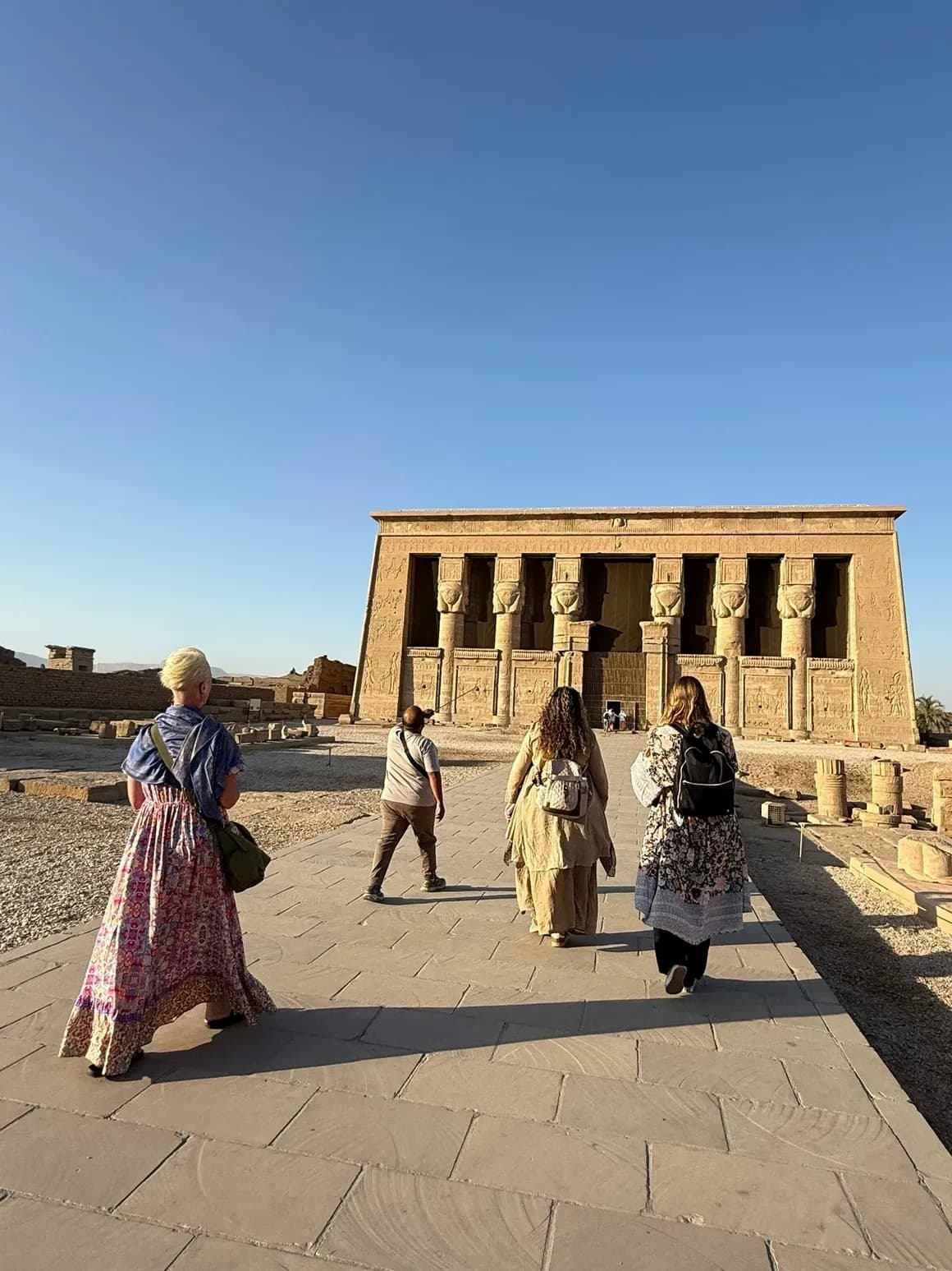 Travellers approaching an Egyptian temple