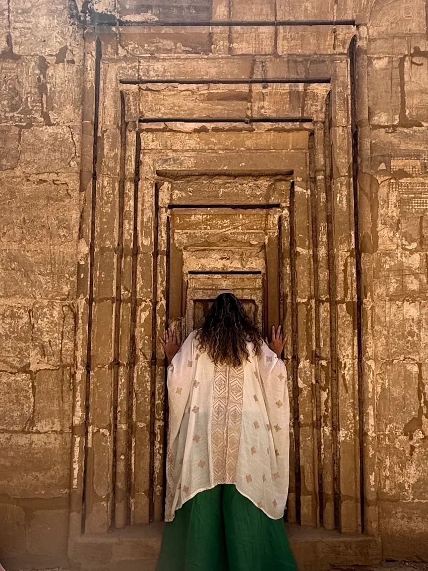 A traveller within an ancient temple doorway