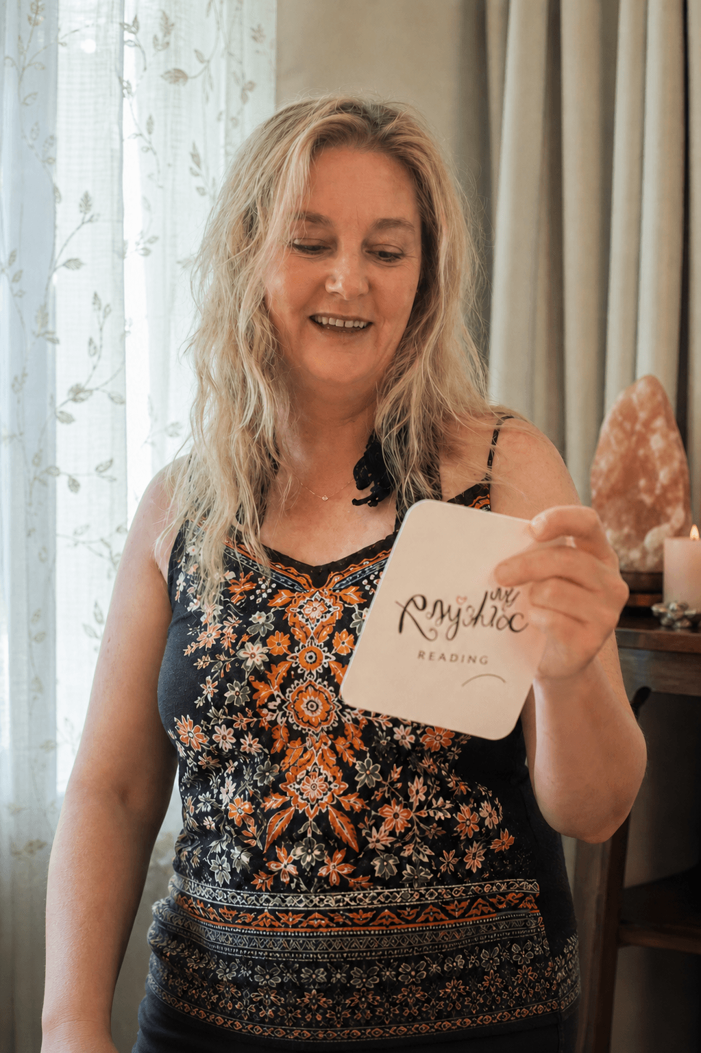Nic holding a card during an intuitive psychic reading