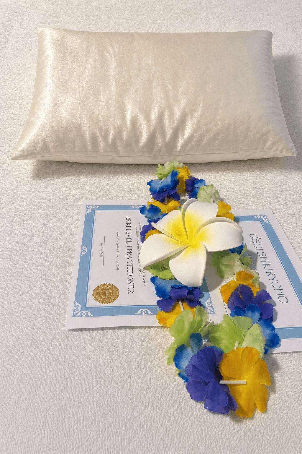 A Reiki Level 1 certificate and floral lei prepared for training